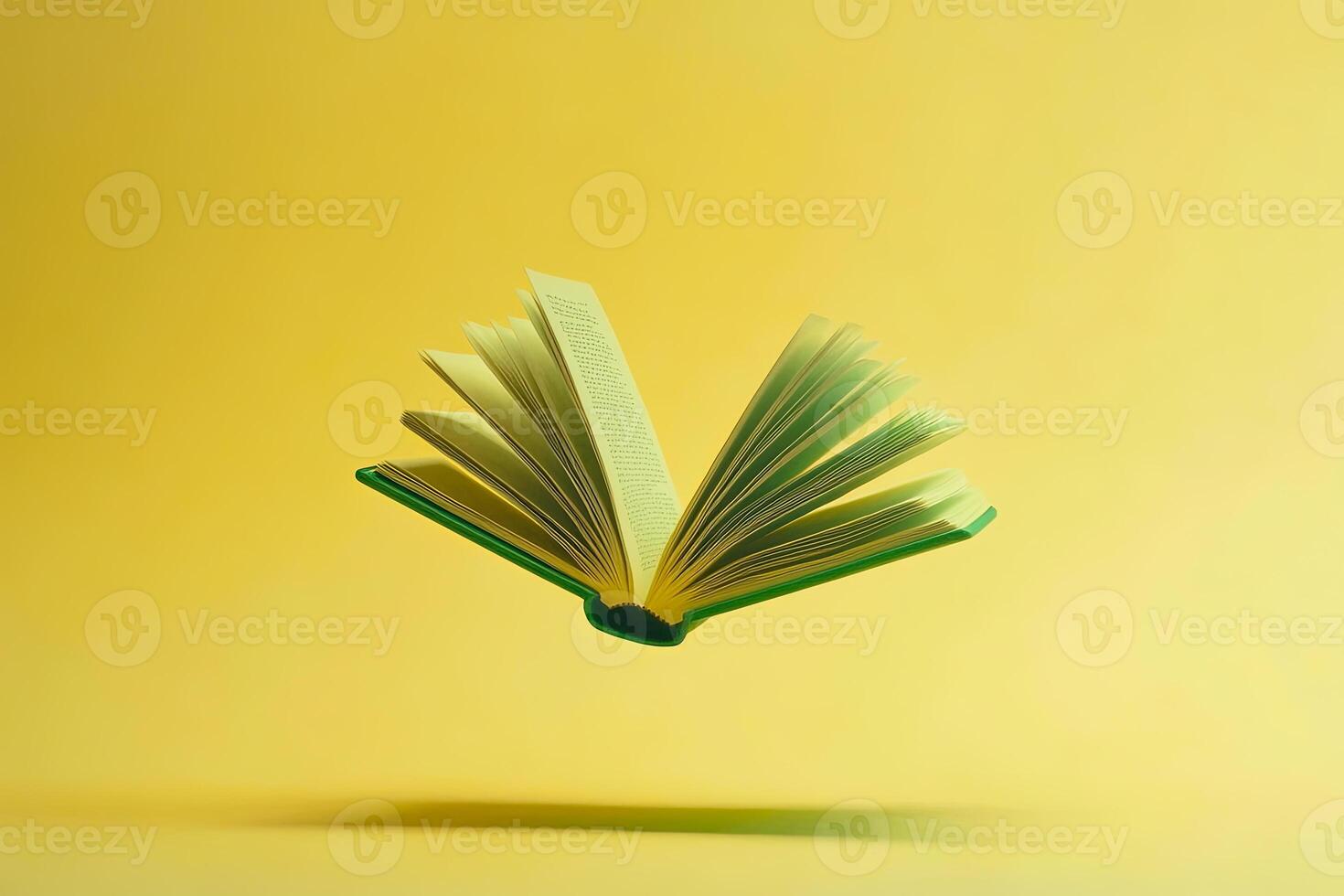 Floating Open Book on Yellow Background photo