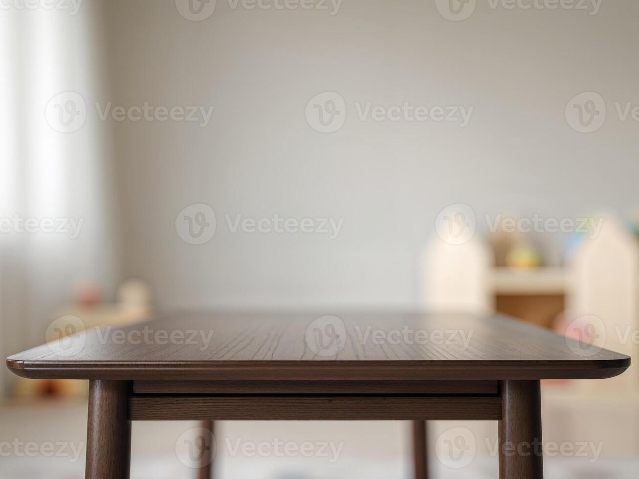 Empty Wooden Table Top with Blurred Playroom Background for Product Placement or Design photo