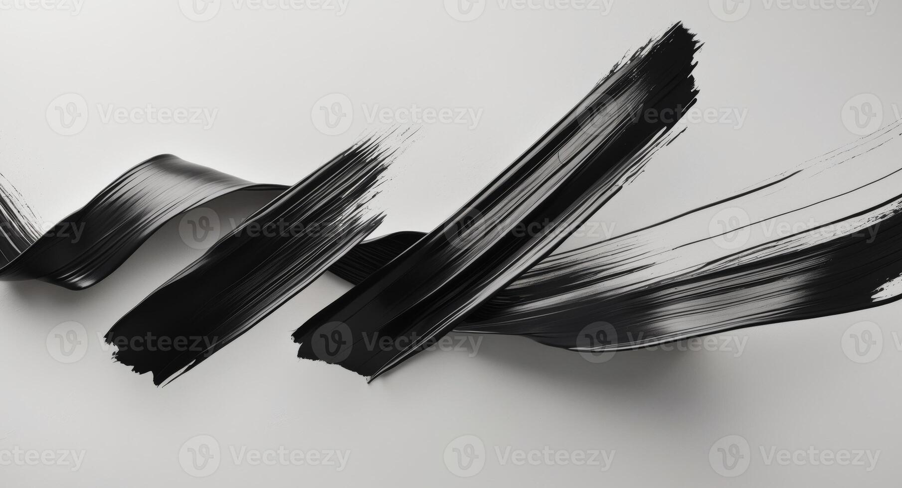 Black paint brush strokes on white background photo