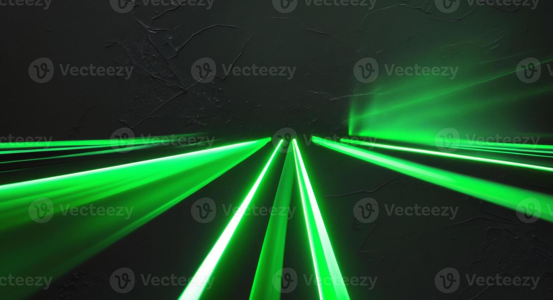 Green laser beams in a dark room photo