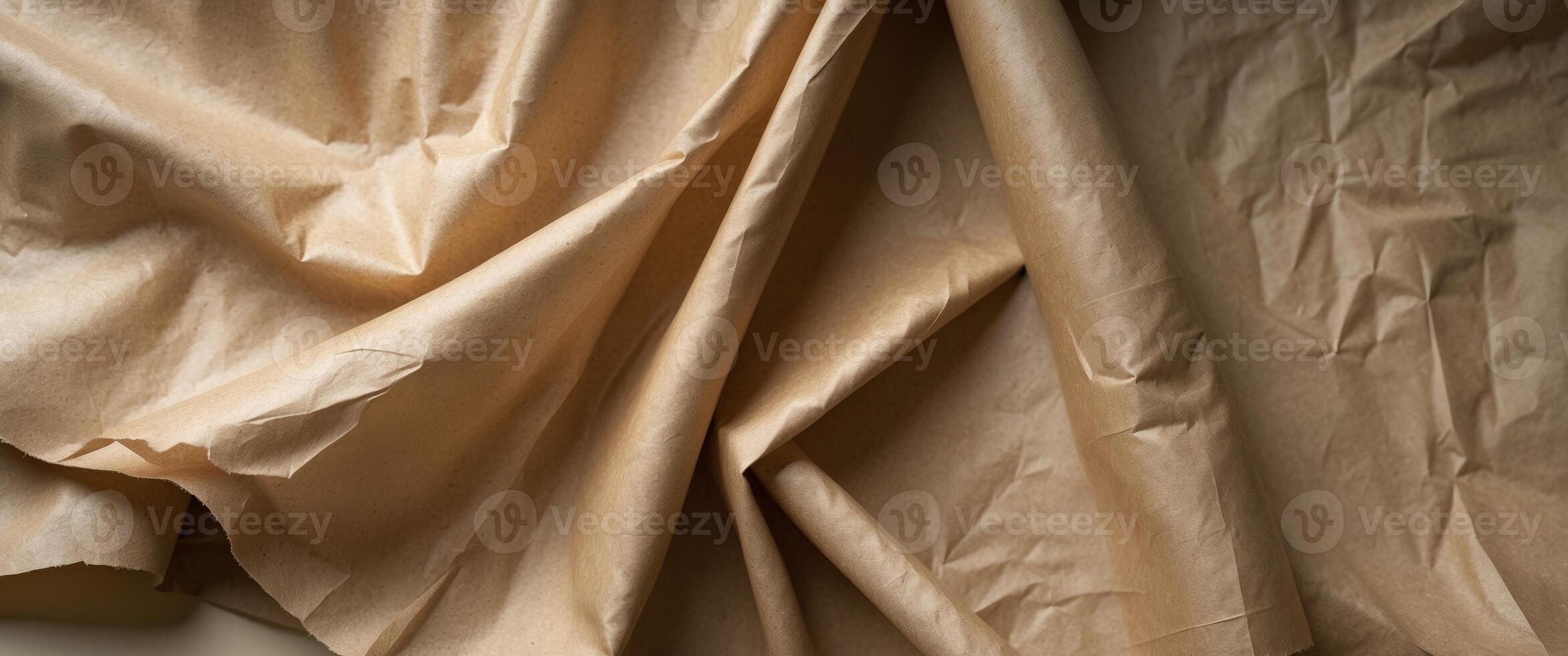 Soft and textured kraft paper drapes gently with natural folds and creases for a rustic feel photo