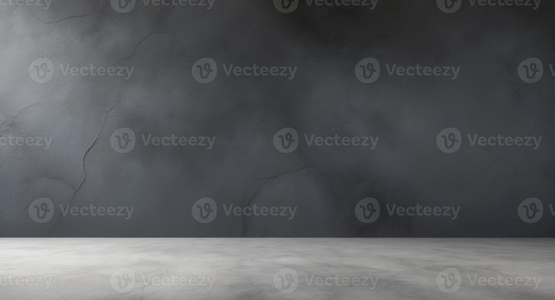 An empty room with a concrete wall and a concrete floor photo