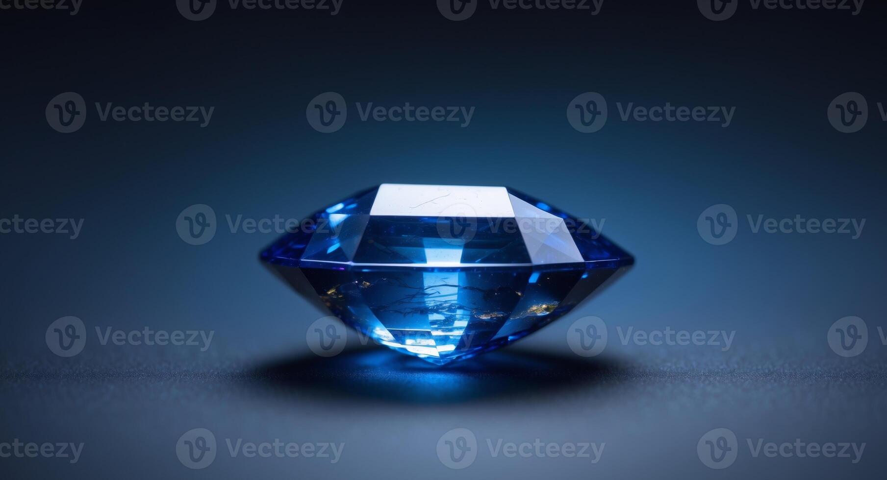 Close up of a natural blue sapphire on a black blue background. photo