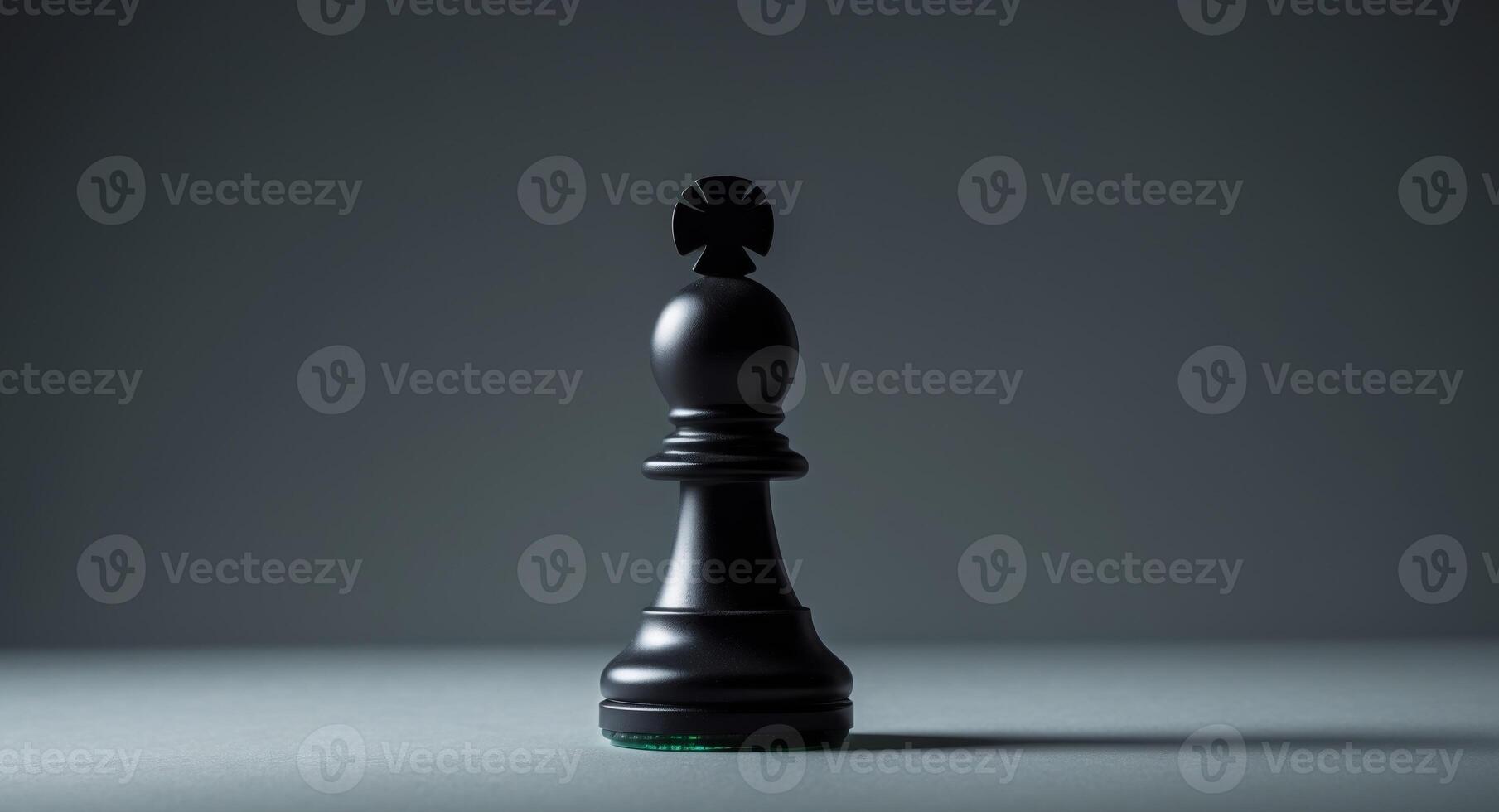 Black chess pawn positioned on a dark surface with intriguing lighting effects. photo
