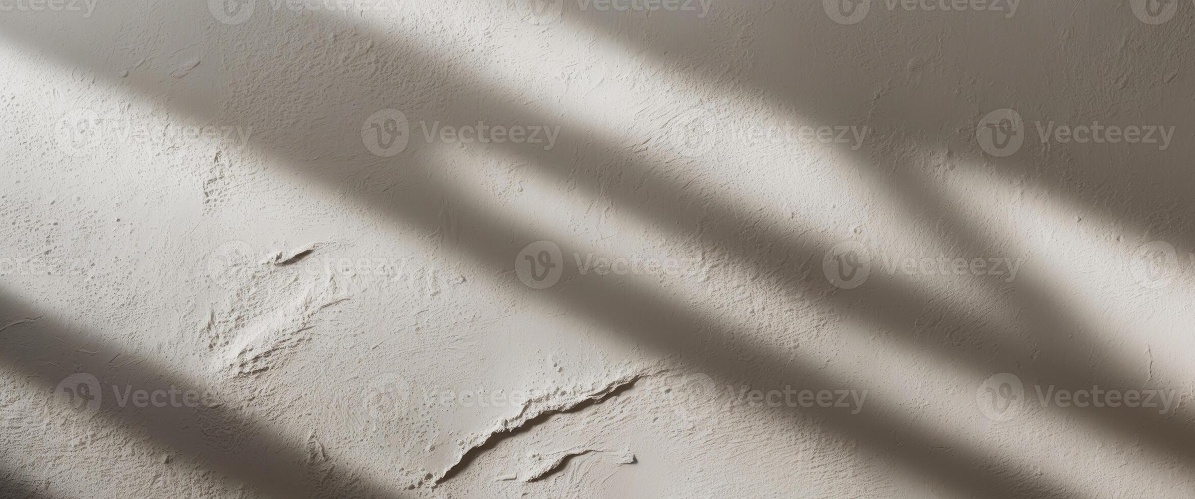 Venetian plaster showcases rough texture with side lighting and bright backdrop for depth. photo