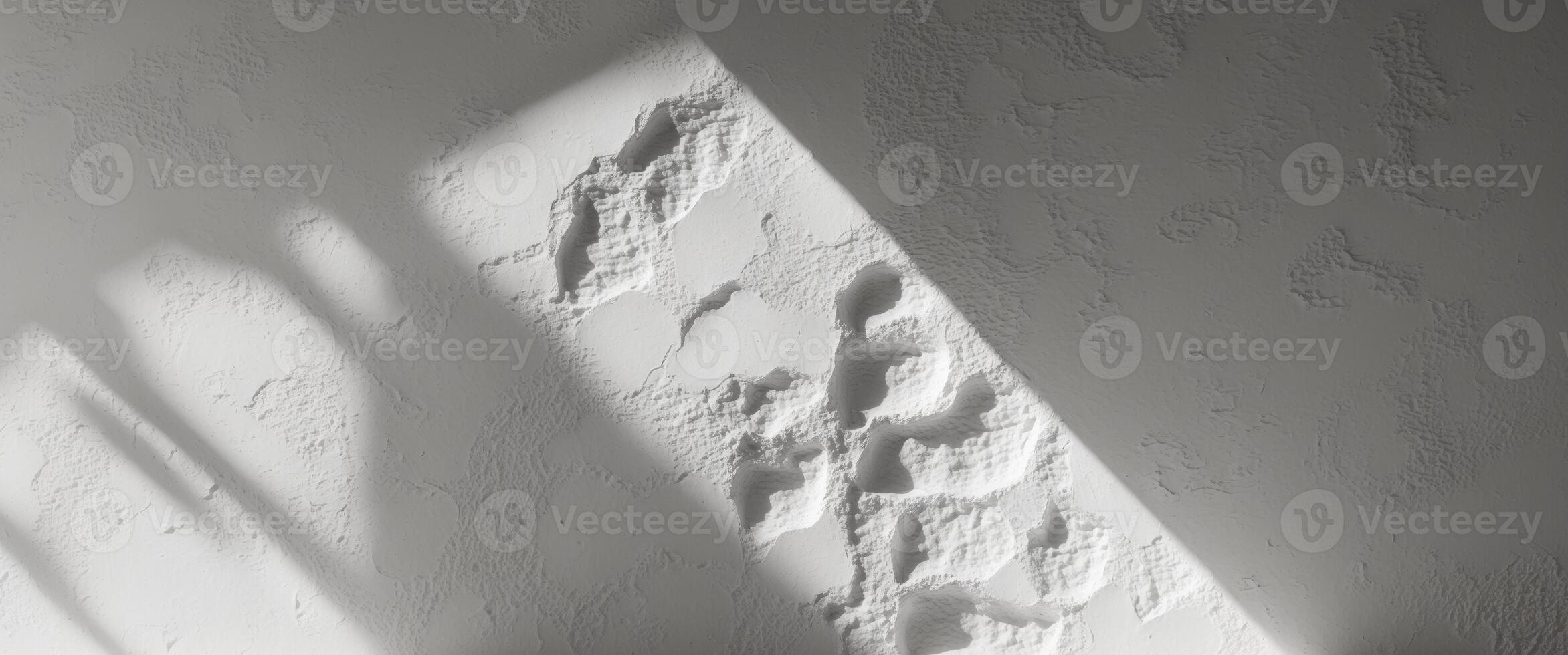 A shadow cast on a wall by the sun photo