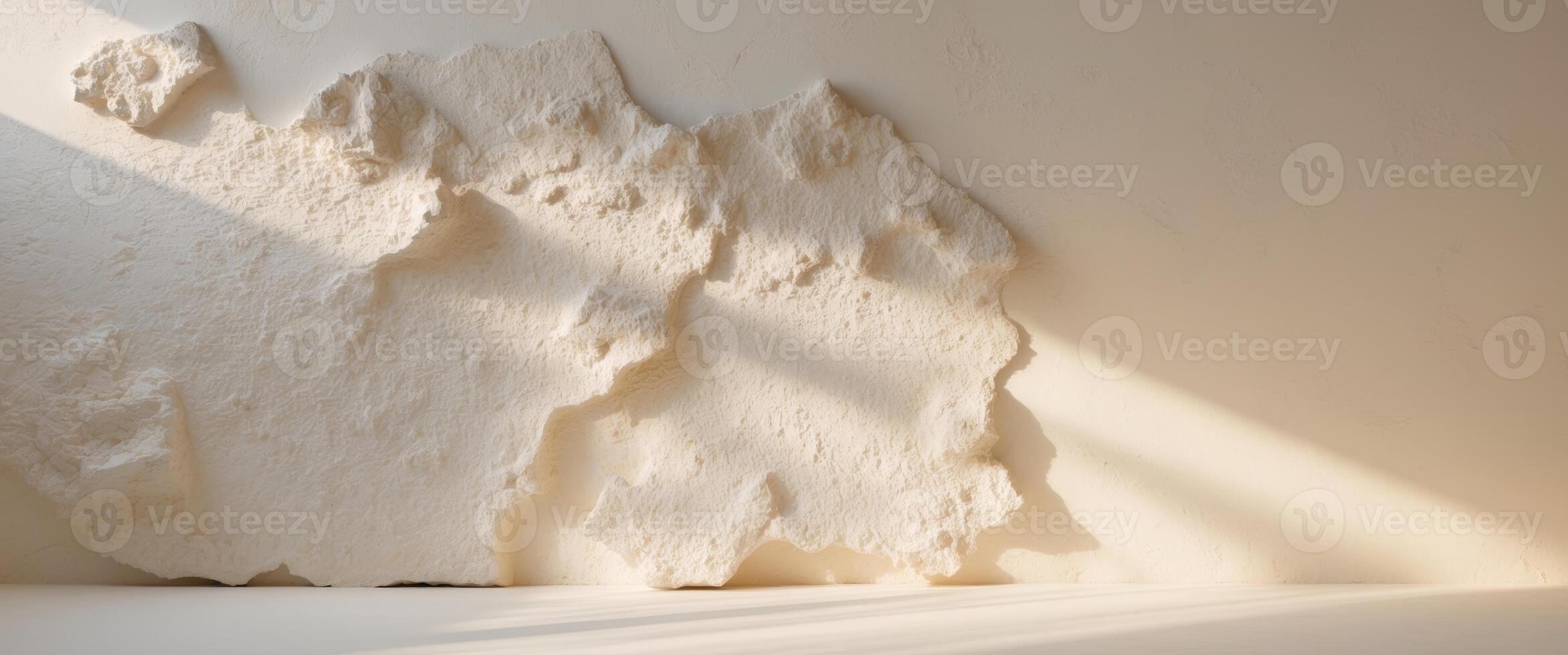 A wall with a large piece of white plaster photo
