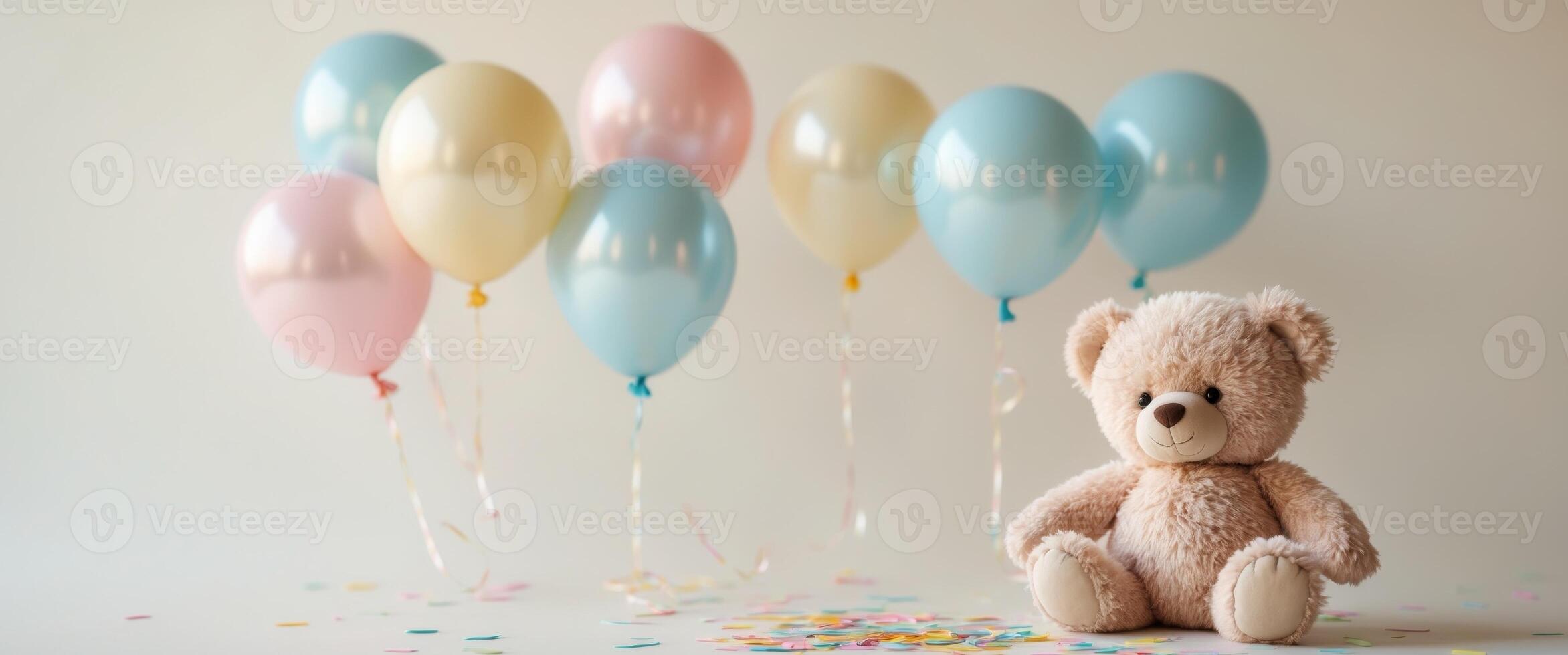 A teddy bear is sitting next to balloons photo