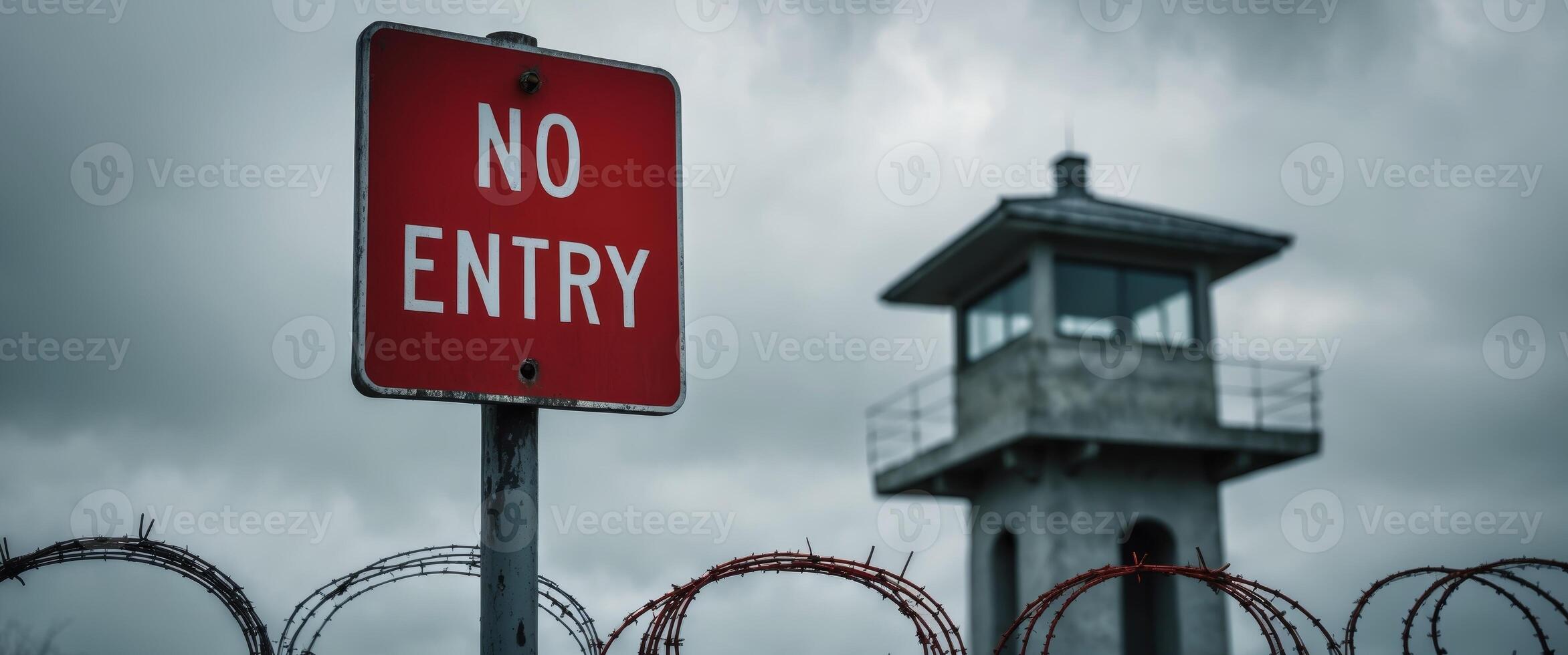 A no entry sign is shown next to barbed wire photo