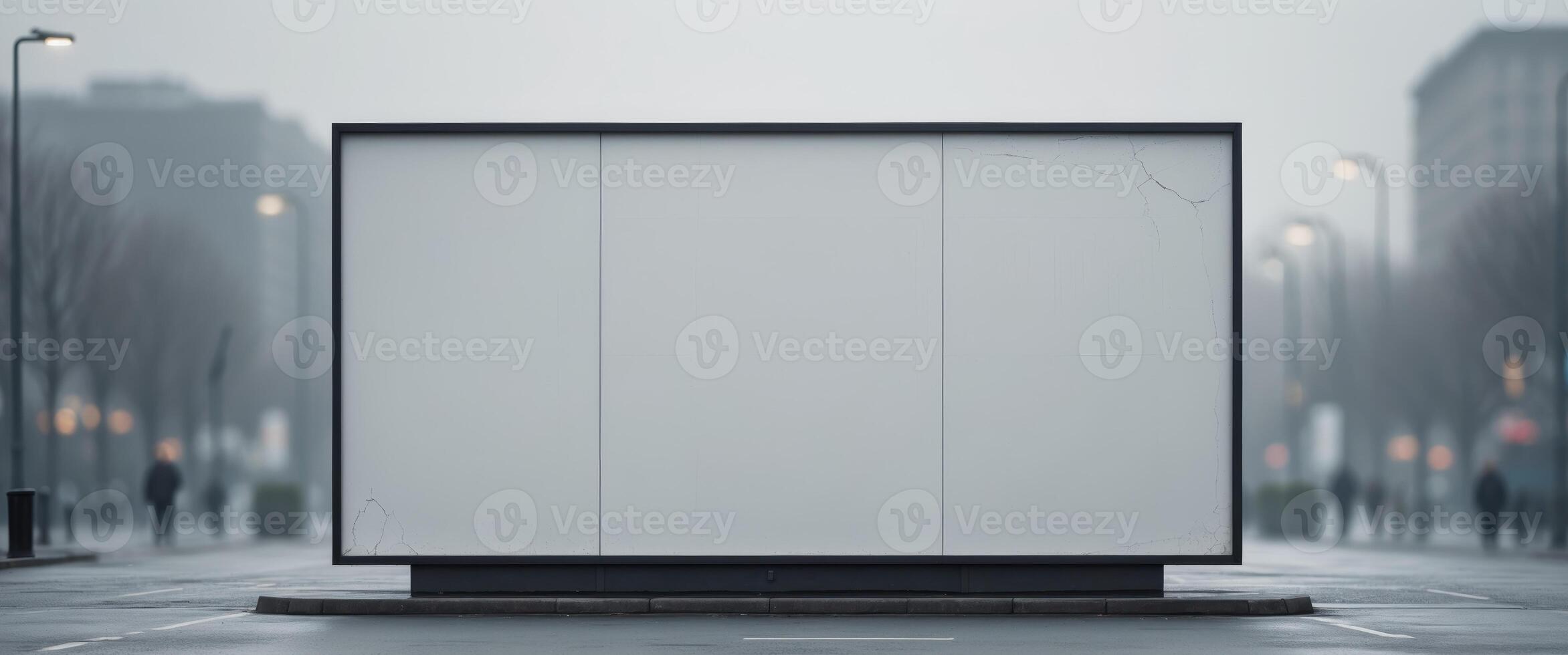 A blank billboard is sitting on the side of a street photo