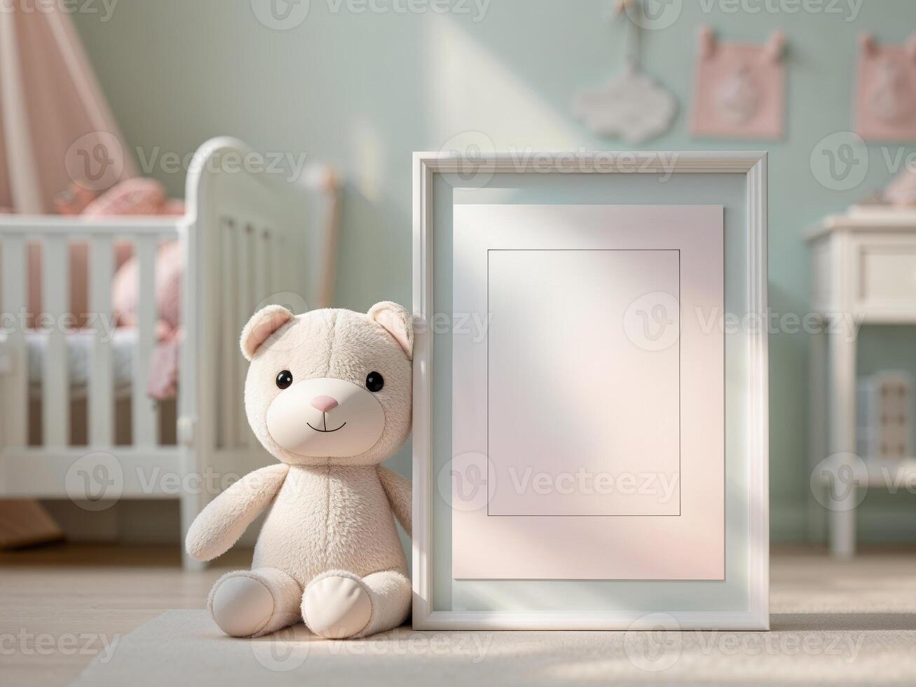 A teddy bear sits next to a blank frame in a baby room photo