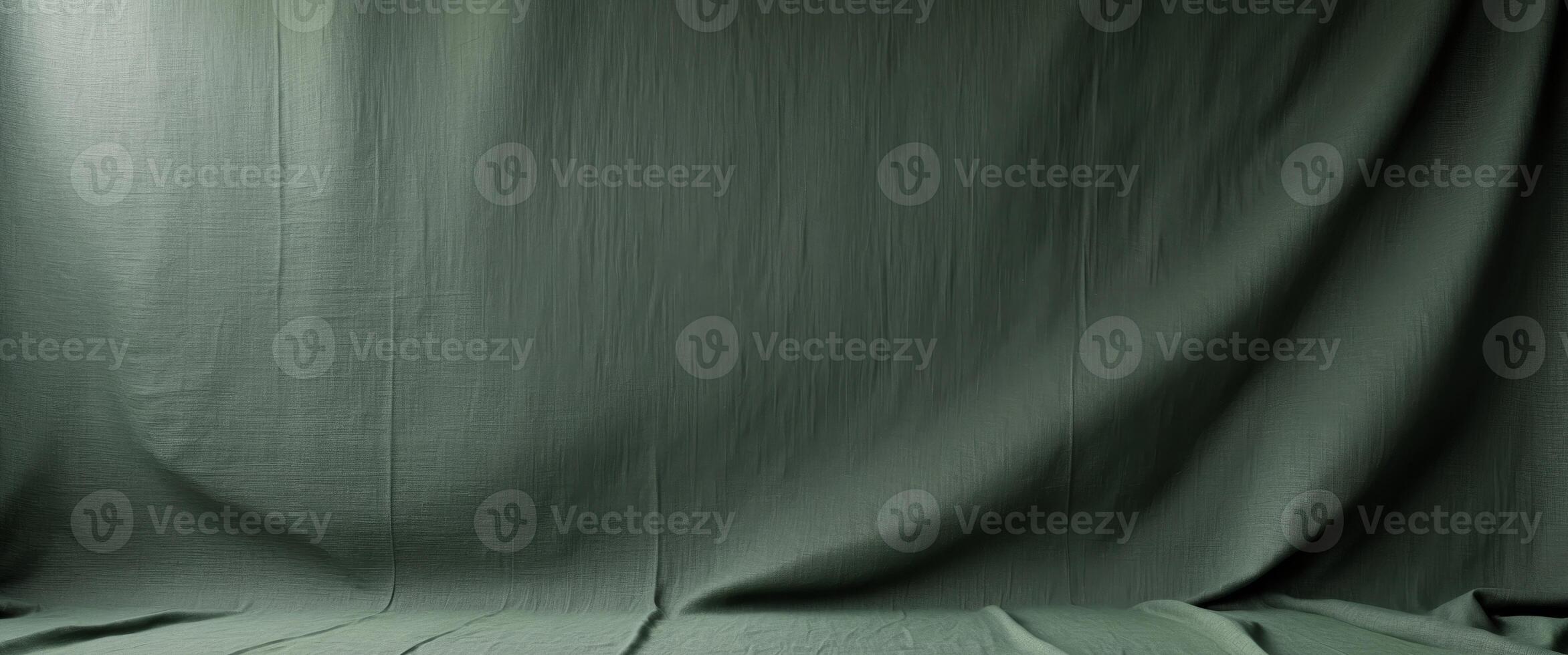 blank uncoated canvas or scrim for background long and wide panoramic banner background from rough linen dark green cloth or burlap. photo
