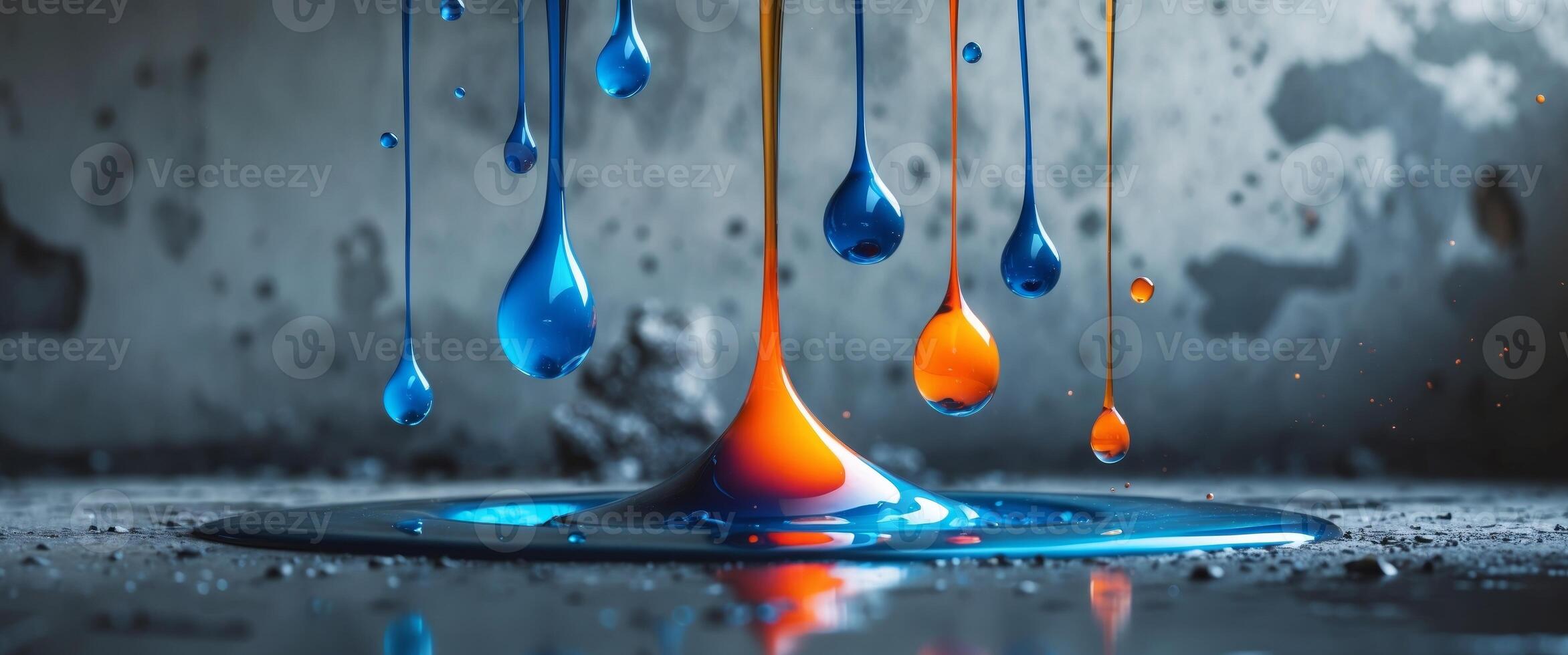 A colorful liquid dripping from a drop of paint photo