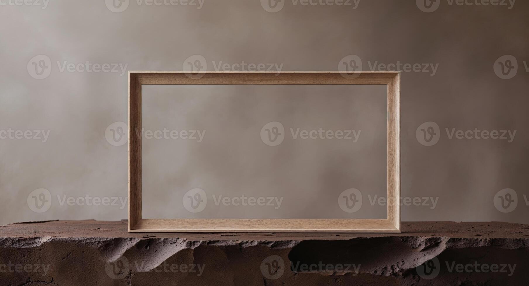 Rectangular wooden picture frame on dark brown textured surface photo