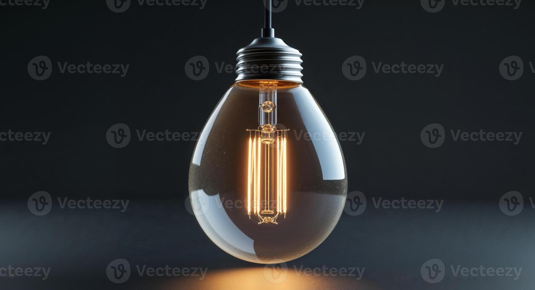 a light bulb that is glowing in the dark. photo