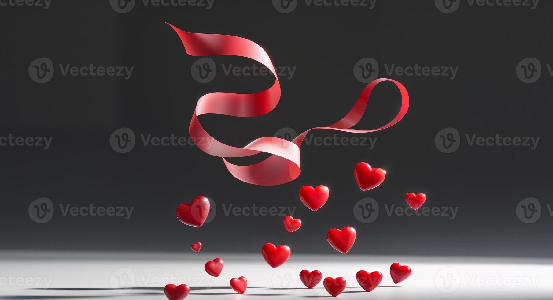 A black background with red ribbon and red hearts. photo