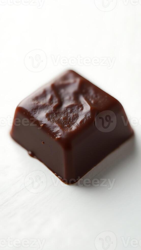 Closeup view of dark chocolate confection showing texture and sheen photo
