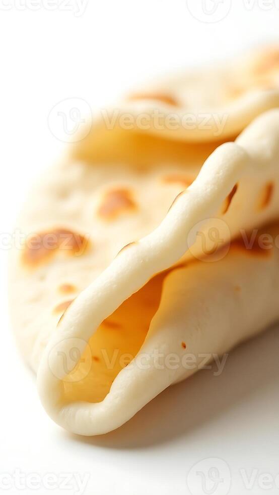 Closeup view of freshly made flatbread stacked with soft texture and rich patterns photo