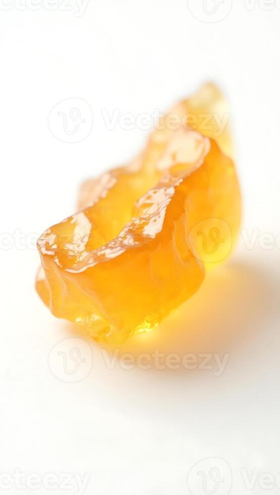 Extreme closeup of a translucent yellow crystal highlighting its unique texture and form photo