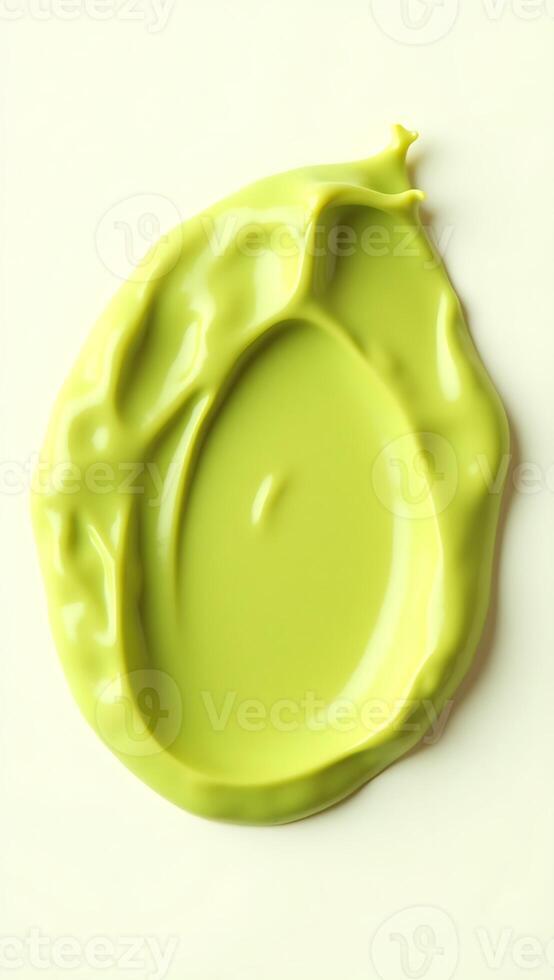Extreme closeup of smooth green paint spread on a light surface photo