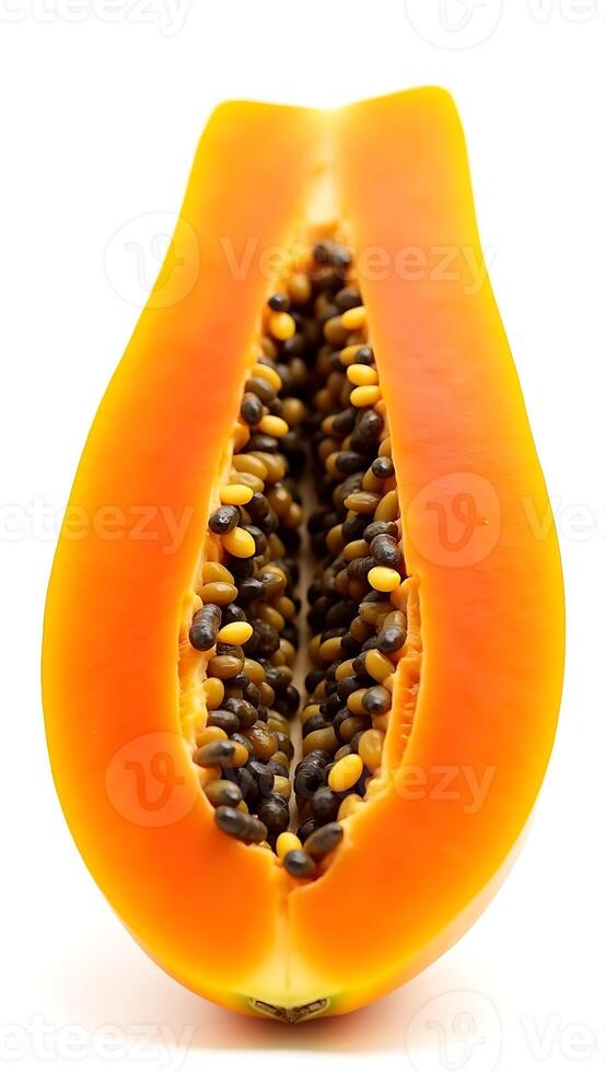 Closeup of a halved papaya revealing its black seeds and vibrant orange flesh photo