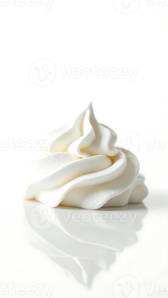 Closeup of smooth whipped cream swirl on reflective surface under soft light photo