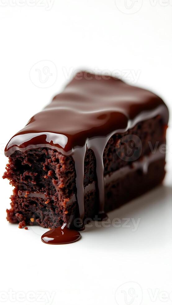 Decadent chocolate cake slice with rich ganache dripping down the sides photo