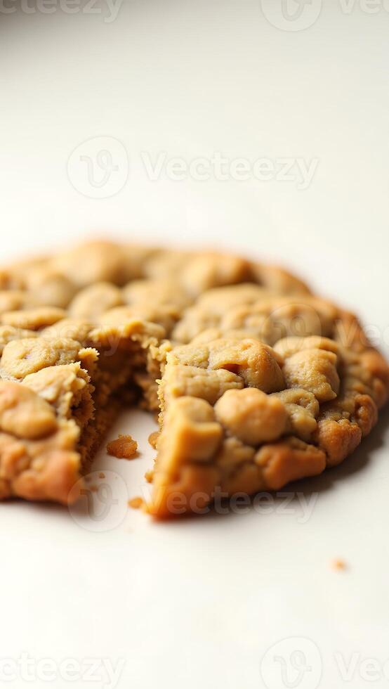 Closeup view of a baked cookie with a bite taken out and soft texture visible photo
