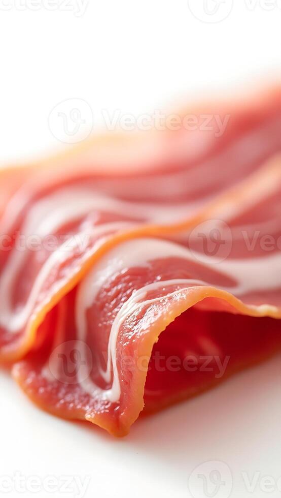 Close-up view of delicately arranged slices of cured meat with smooth texture photo