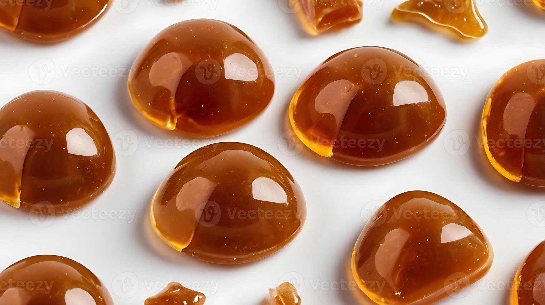 Closeup of caramel candies highlighting texture and glossy surface detail photo