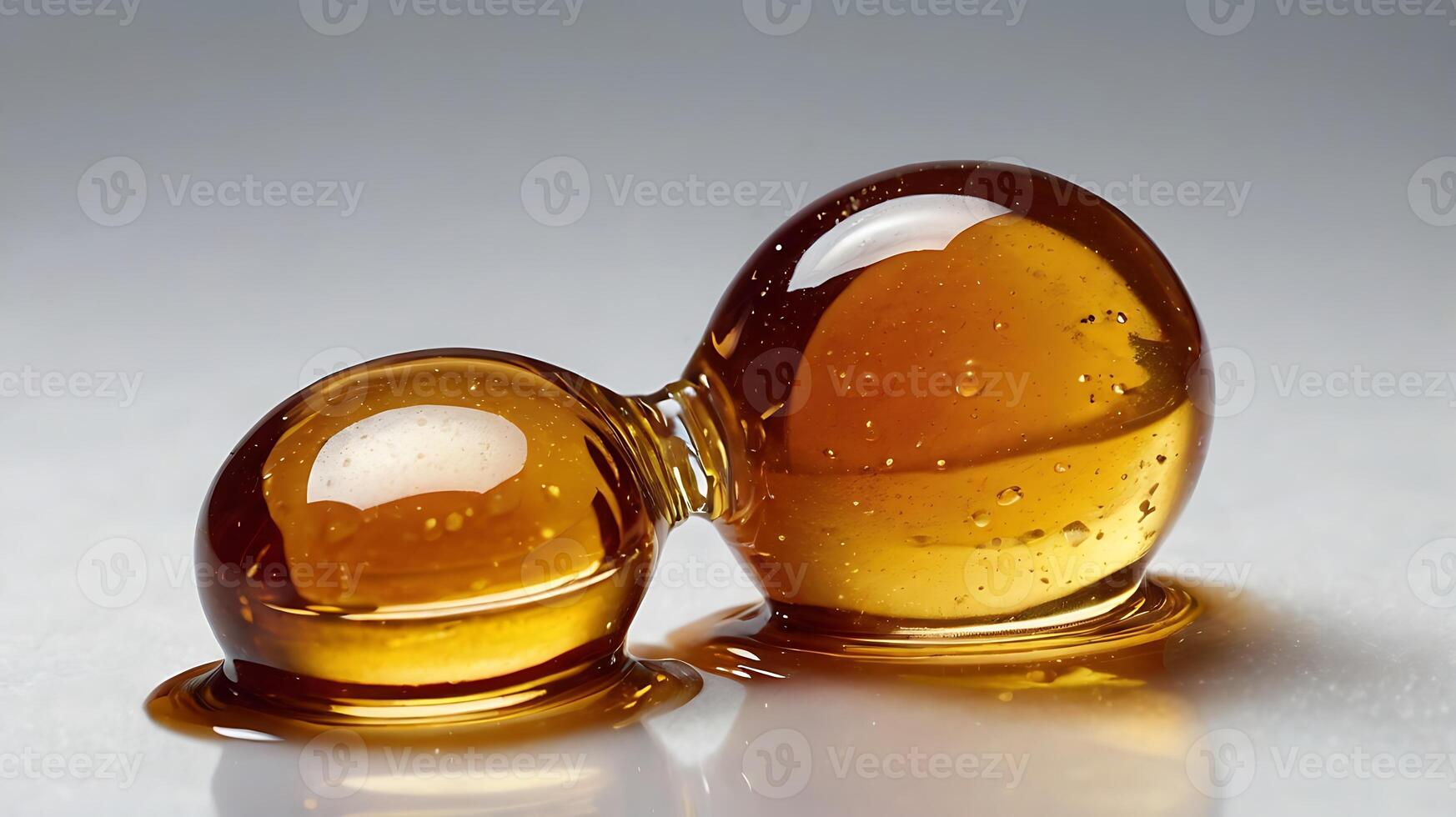 Closeup of maple syrup droplets demonstrating texture and color photo
