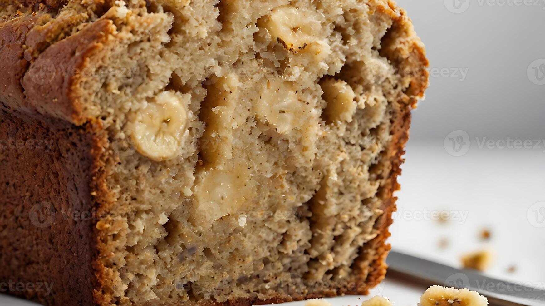 Closeup view of a moist slice of banana bread showcasing its texture and flavor photo