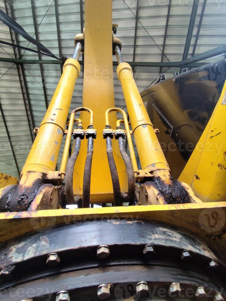 Close-Up View of Excavator Engine and Hydraulic Hoses with Metal Details photo