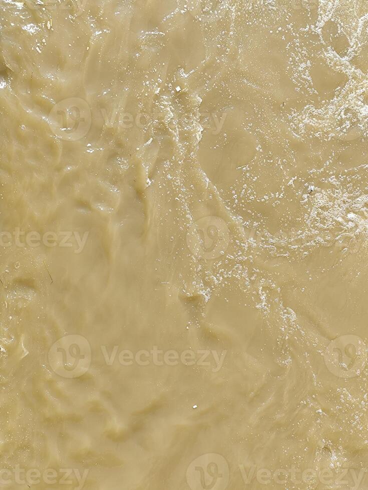 Muddy River Current Creating Organic Foam Textures photo