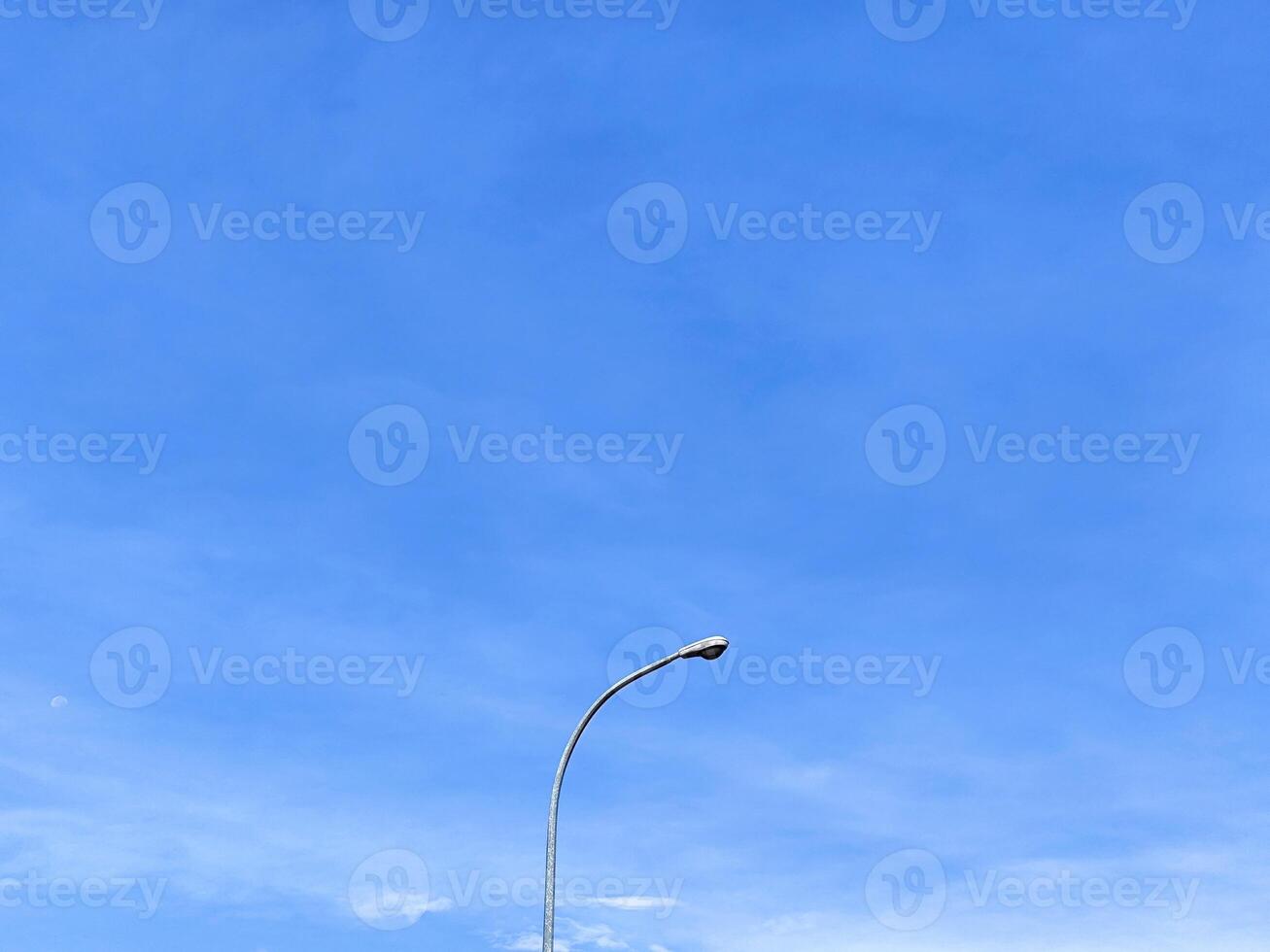 Minimalist Street Light with Bright Blue Sky Background photo
