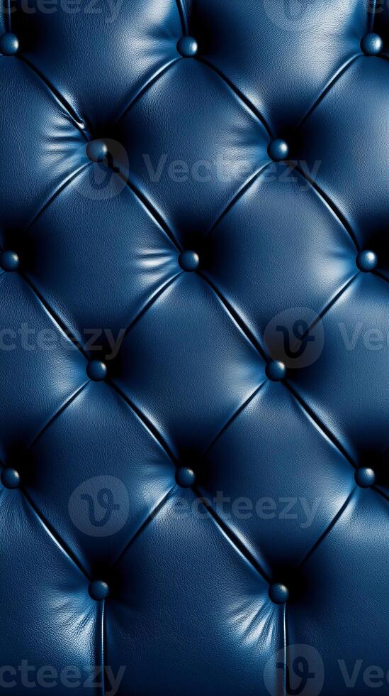 Diamond-tufted dark blue leather upholstery adorned with buttons, providing a luxurious and refined texture, perfect for high-end furniture or interior styling. photo