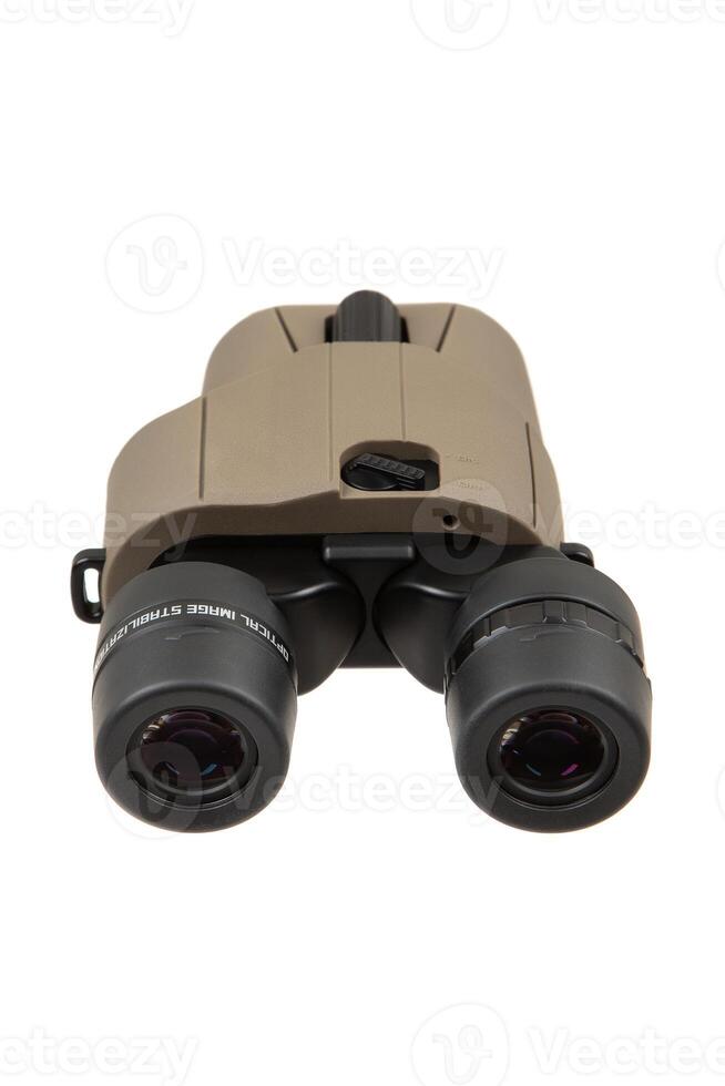 Image-stabilized, compact binoculars featuring a tan body and black eyepieces, isolated on a white backdrop. photo