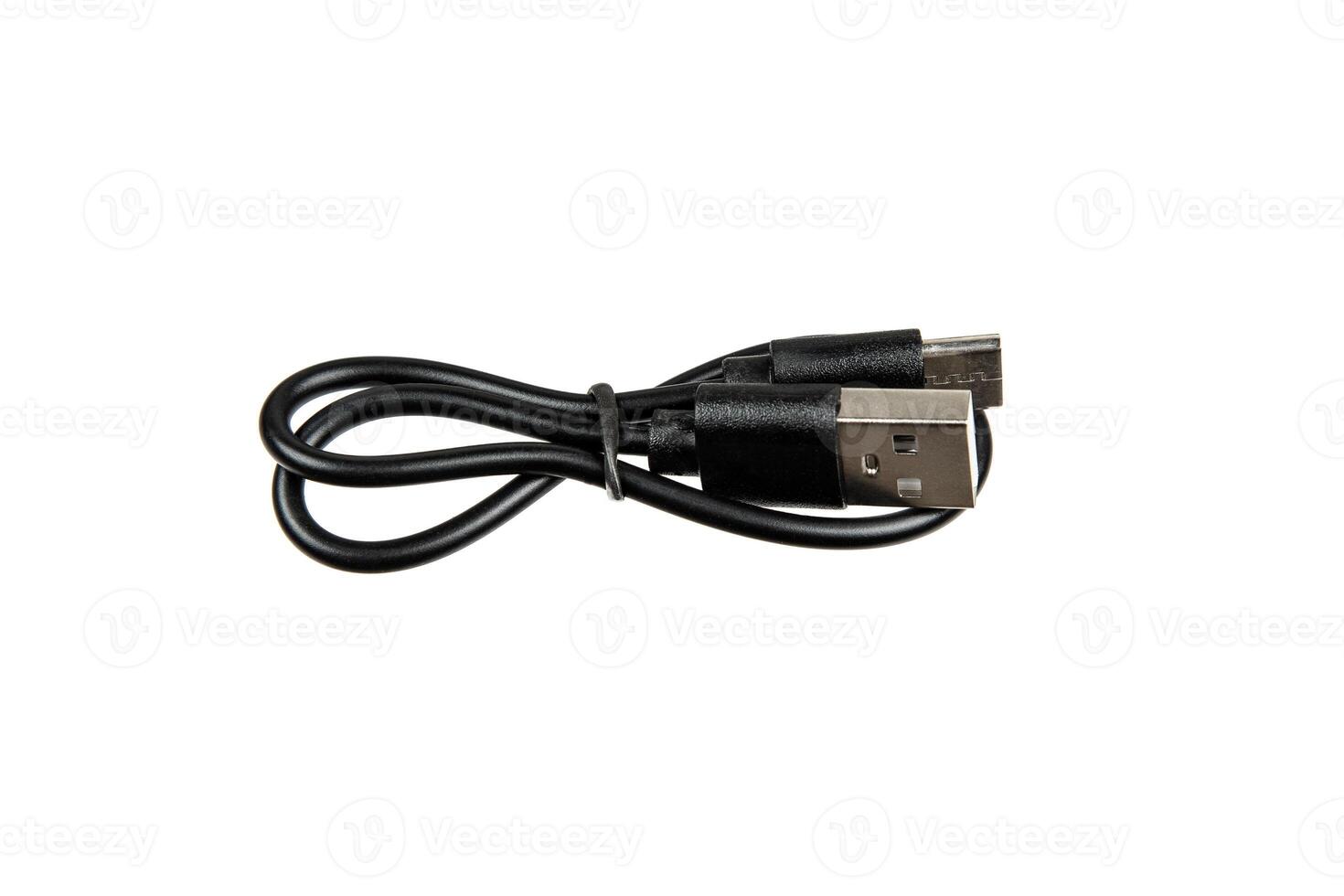 Black USB cable with USB-A and USB-C connectors, coiled neatly and isolated on white, ideal for charging and data transfer for a range of electronic devices. photo