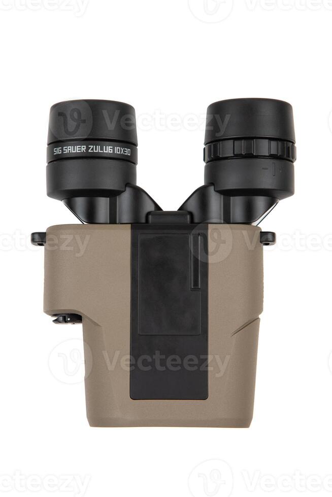 Compact binoculars with a tan exterior and black eyepieces, equipped with image stabilization technology, against a white background. photo