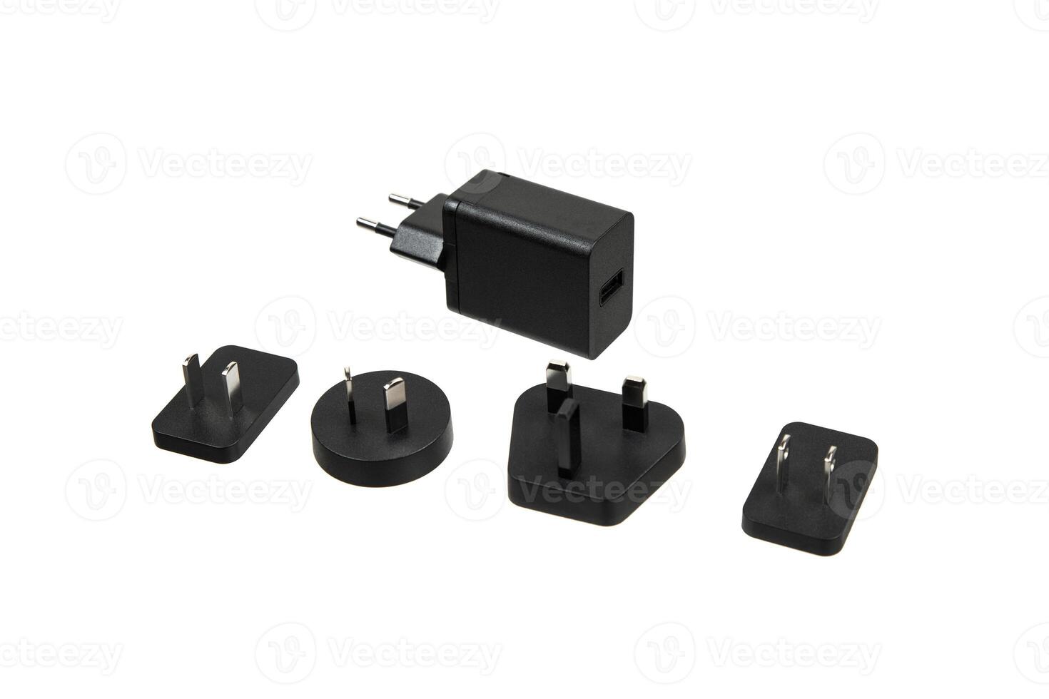 Universal travel adapter with multiple plug types, including European, UK, US, and Australian plugs, versatile for international use, isolated on a white back photo
