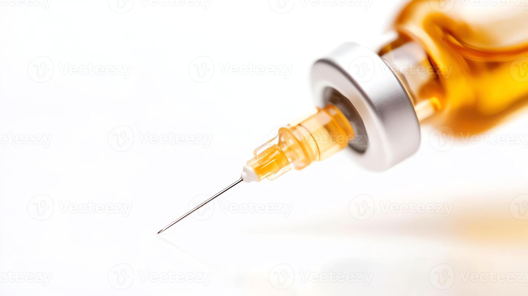 Close-up view of a syringe filled with amber liquid, showcasing the sharp needle and its precise design photo
