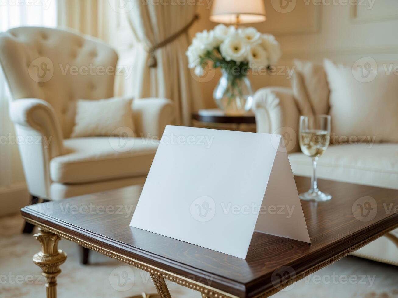 A white card on a table in a living room photo