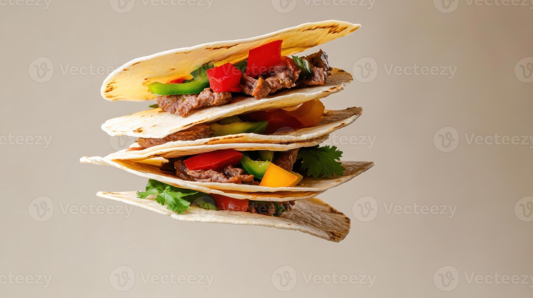 Delicious Mexican tacos filled with flavorful beef and fresh vegetables stacked in the air for a vibrant culinary presentation photo