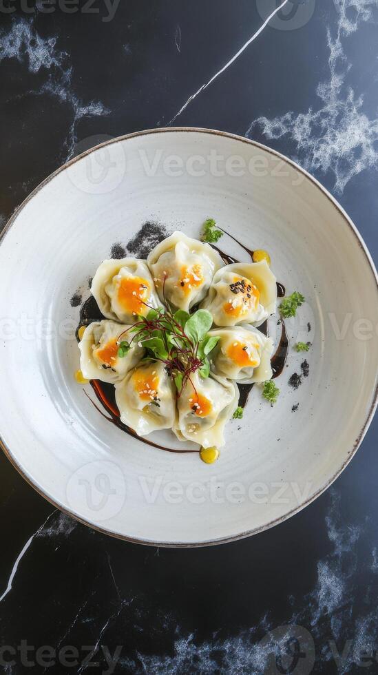 Dumplings in creamy sauce served on elegant plate with fresh herbs and vibrant toppings photo