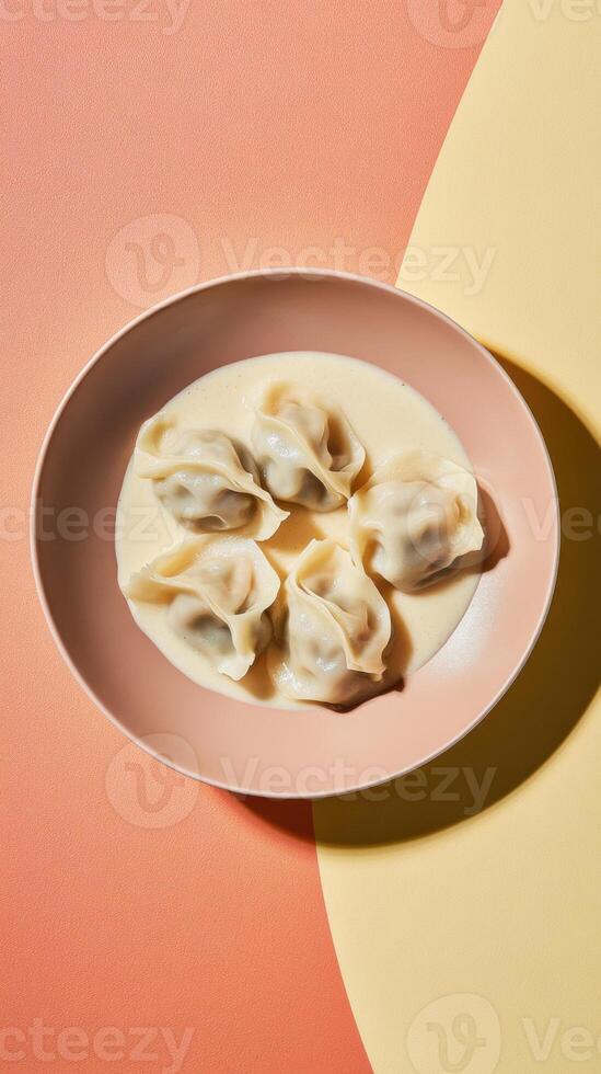 Dumplings served in creamy sauce on a pastel background creating an artful culinary display photo