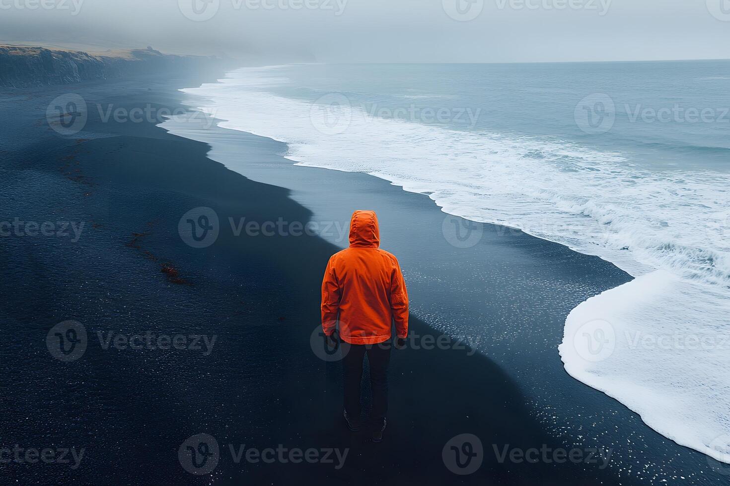 Solitude on Misty Black Sand Beach Adventure Travel Concept photo