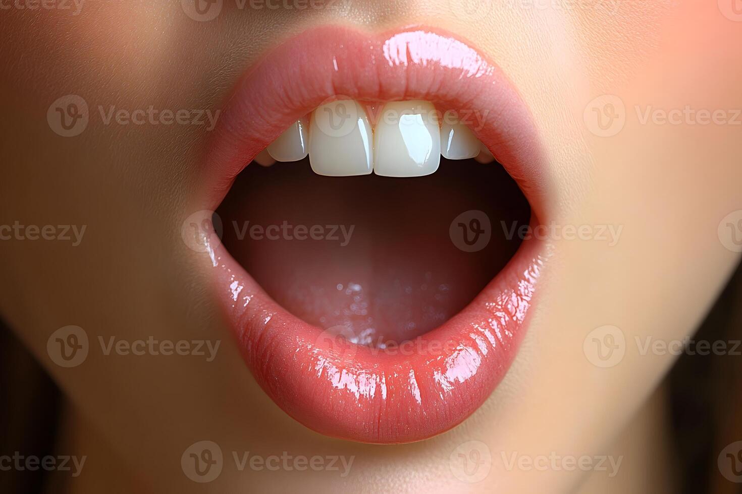 Close-Up of Open Mouth with Glossy Lips and White Teeth - Beauty and Fashion Concept photo