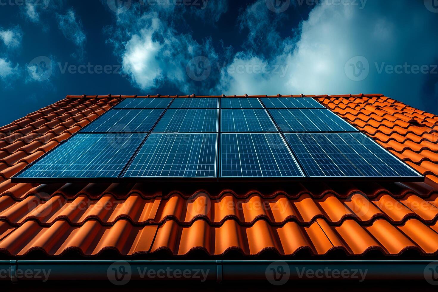 Renewable Energy Concept with Solar Panels on Red Tiled Roof Against Blue Sky photo