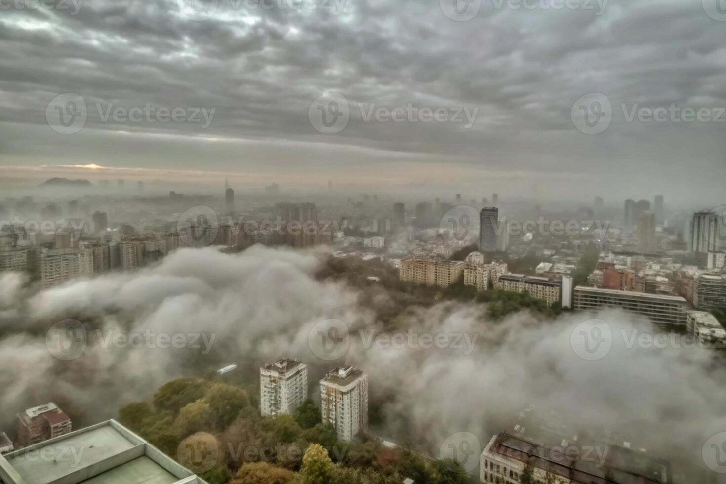 A city is covered in fog as seen from above photo