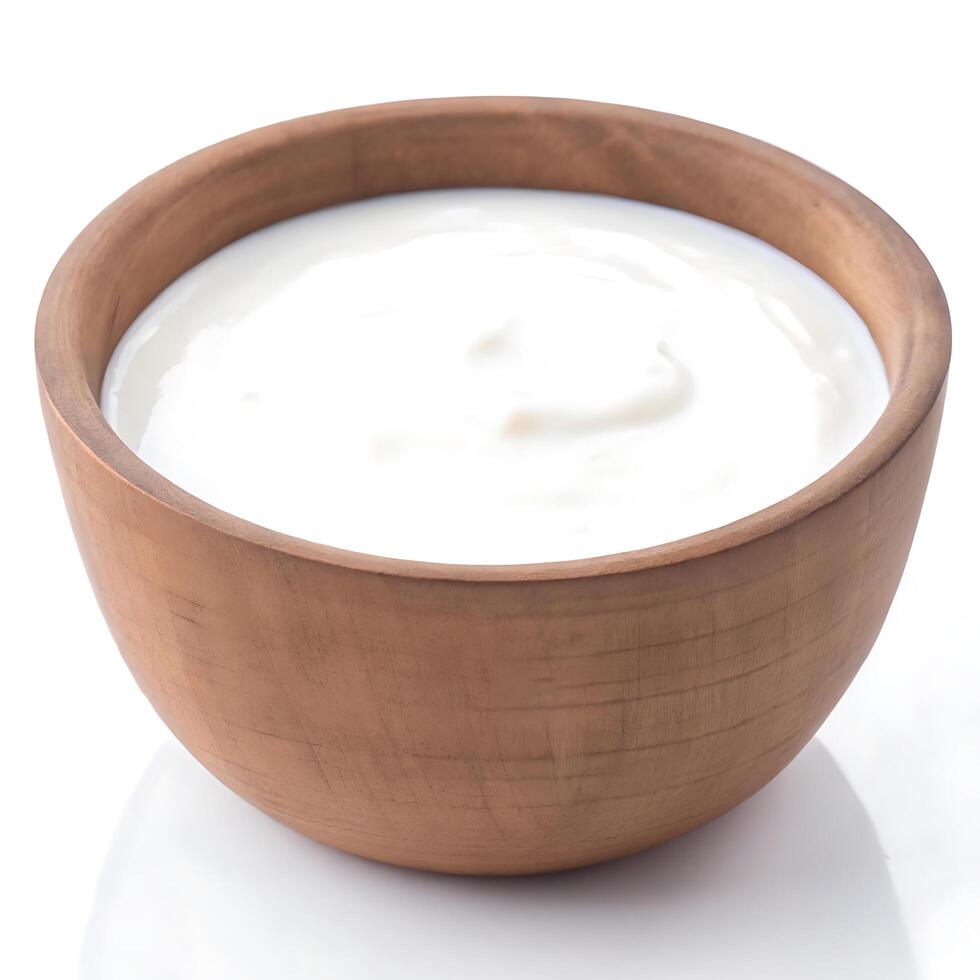 Yogurt in a wooden bowl on a white background photo